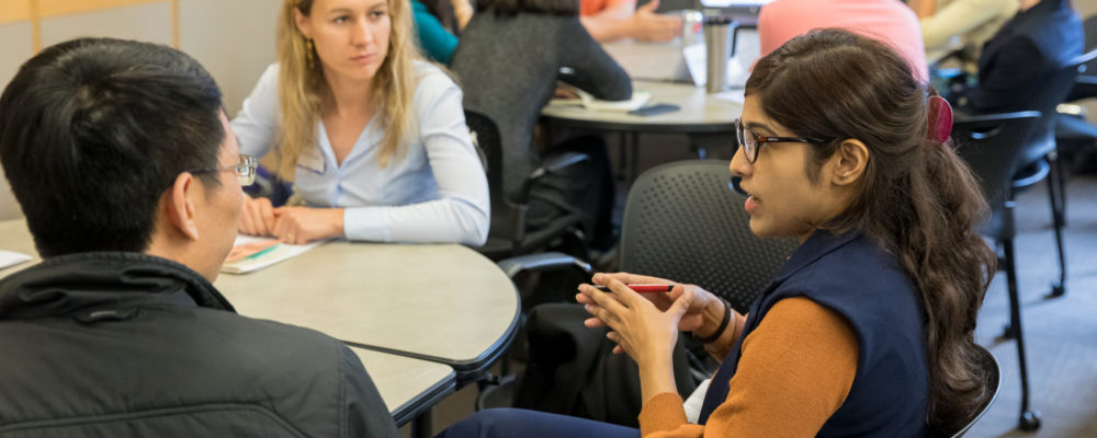 Deeksha Sharma, Daria Bottan, and Bo Yang in discussion at the May 2019 Connecting Research and Teaching Conference
