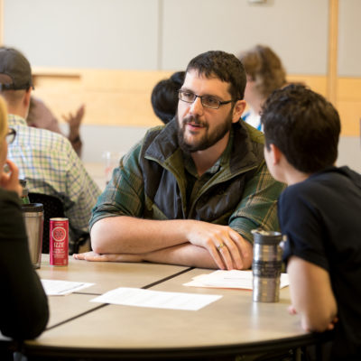 Graduate Student Eugene Law leads a small group discussion about mentoring strategies