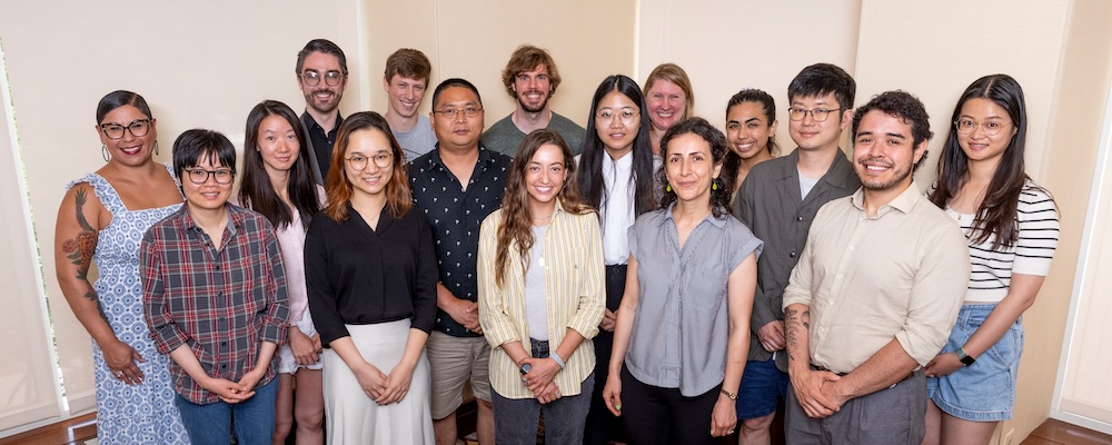 Group shot of approximately 15 early career scholars in casual clothing